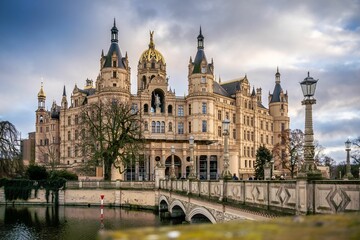 Poster - Schwerin Castle in Schwerin, Germany against blue cloudy sky background