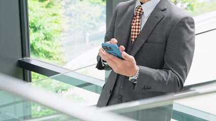Poster - Middle aged businesspeople using smart phone in office.