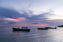 Wooden Fishing Boats In A Jamaican Bay At Dawn