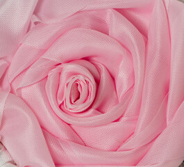 Wall Mural - pink rose from ribbon close-up, texture, background, wallpaper.