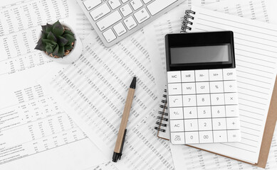 Poster - Calculator, keyboard, pen and notebook lying on financial documents . Financial and business concept.