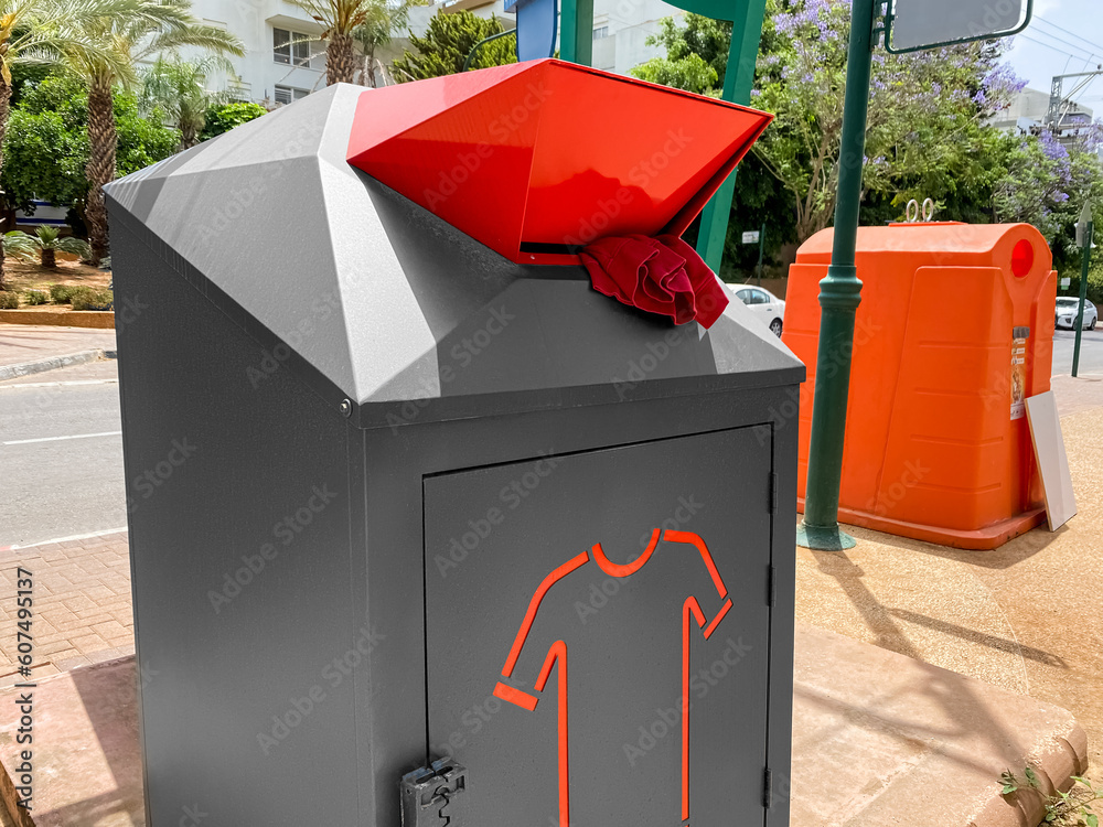 Garbage container for clothes on city street