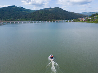 Wall Mural - boat in lake with empty space for text on water