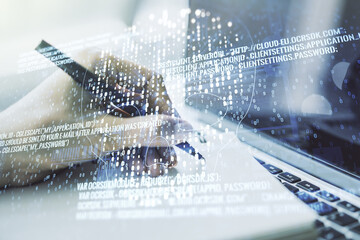 Poster - Double exposure of creative code skull hologram and hand writing in notebook on background with laptop. Malware and cyber crime concept