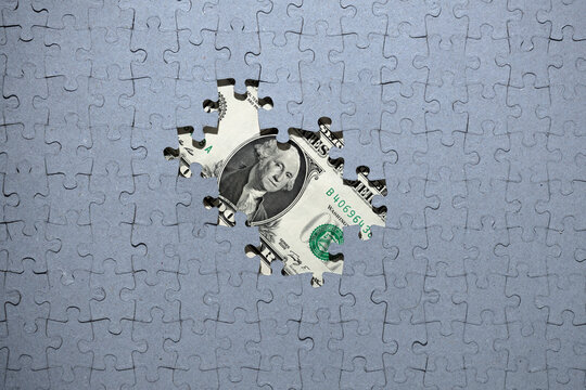 Wall Mural - Missing puzzle pieces on the background of money, hidden assets, tax amnesty, american dollar concept