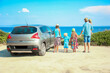 © Kostia - A happy family by car by the sea in nature weekend travel