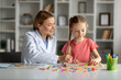 © Prostock-studio - Educational Therapy. Cute Little Girl Having Session With Therapist Lady In Office