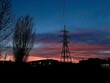 Power lines at sunset. Beautiful evening sky. Bright colors.