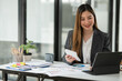 © aekachai - Asian woman lawyer businesswoman Working to view legal documents at the office