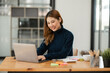 © aekachai - Asian business woman Working at the office, use notebook, smart phone
