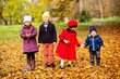 © oksix - Group of friends play in autumn park