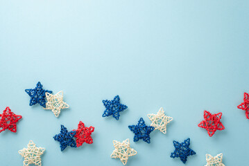 Wall Mural - Embrace the festive mood of Independence Day with symbolic party elements:top view of rattan stars. The pastel blue backdrop provides an empty space perfect for text or adverts