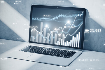 Aufkleber - Close up of laptop at workplace with creative candlestick forex chart or graph on blurry background. Financial trade market and stock concept. 3D Rendering.