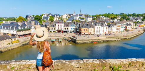 Wall Mural - Woman tourist traveling in Brittany- Saint Goustan port, Auray city landscape- France, Morbihan