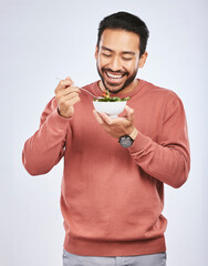 Poster - Man is eating salad, healthy food and lose weight with nutrition, detox and vegetables isolated on studio background. Health, wellness and vitamins with hungry male person, eat meal and diet