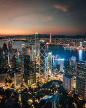 Aerial View Of Hong Kong Skyline And The Financial District At Sunset Along Hong Kong Island Coastline, China.