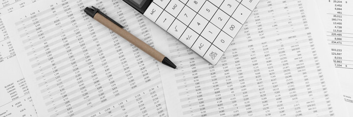 Poster - Calculator with pen on financial documents. Top view.