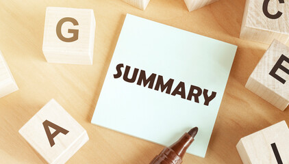 Poster - Sticker with text summary in the middle of wooden cubes with letters