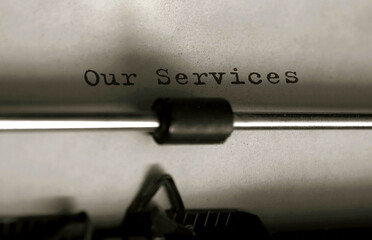 Fototapete - Text our services typed on retro typewriter