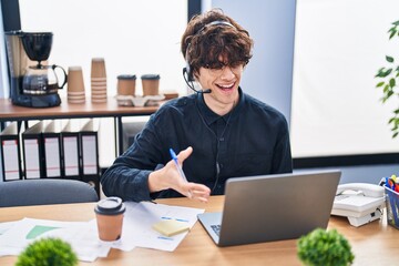 Poster - Young hispanic man call center agent having video call working at office