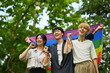 © Prathankarnpap - Happy young LGBT friends with rainbow heart celebrating gay pride, enjoying outdoor activities at outdoor