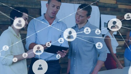 Poster - Animation of network of profile icons against diverse men discussing over a digital tablet at office