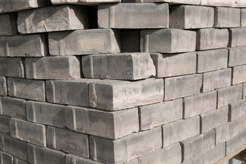  Old square paving slabs laid out in vertical rows. Processing of materials, recycling and storage of bricks.