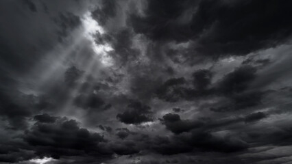 Wall Mural - dark dramatic sky with black stormy clouds before rain or snow as abstract background, extreme weath