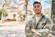 © Krakenimages.com - Young hispanic man smiling confident standing with arms crossed gesture at park