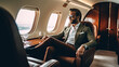 © PaulShlykov - Smiling businessman looking at window in private plane. Business jet interior. Generative AI