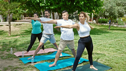 Poster - Group of people training yoga at park