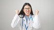 © Krakenimages.com - Young hispanic woman doctor angry and stressed over isolated white background