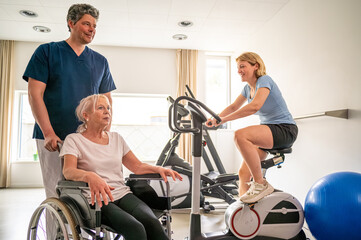 Doctor working with senior woman patient on wheelchair, clinics specialist at work, rehabilitation physiotherapy