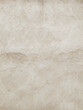 An old beige cement wall background. Vertical orientation. Damaged concrete surface with detailed grunge texture.
