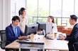 © krongthip - Businessmen and employees sitting on desks in the office business idea.