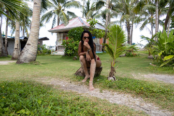 girl sittin on a trunk in a resort