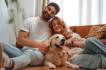 Wall Mural - Couple with dog at home