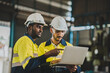 © chokniti - professional technician engineer with safety helmet hard hat working in industrial manufacturing factory, men at work to checking equipment of machinery production technology or construction operating