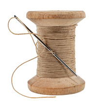 Old Wooden Spool Of Thread And Needle On A White Background. Sewing Accessories