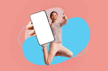 Joyful Asian Woman Jumping And Pointing At Big Blank Smartphone In Hand