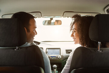 Middle Eastern Spouses Driving Sitting In Vehicle, Back View