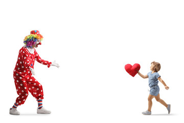 Sticker - Full length shot of a little girl carrying a heart and running to hug a clown