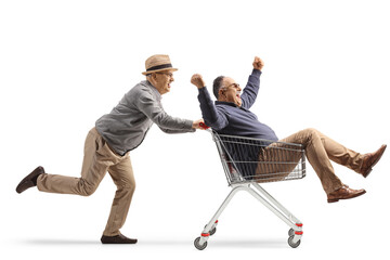 Poster - Senior man riding a man inside a shopping cart