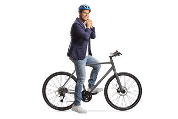 Poster - Man with a bicycle putting on a helmet