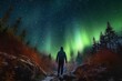 © TULA - Silhouette of a man watching the Northern Lights Aurora Borealis
