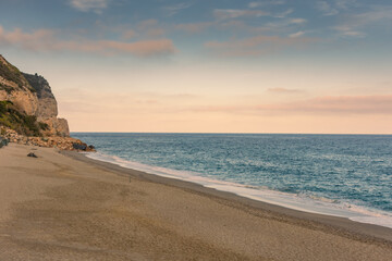 Wall Mural - Sunset over Baia dei Saraceni (Saraceni Bay) Beach, Ligurian Sea,  Italy