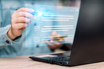 Poster - Business performance checklist. Businessman using laptop to do online checklist survey, doing assessment online survey answer test questions Digital form.