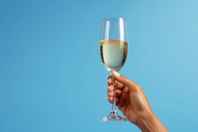 Hand Holding Glass Goblet With Champagne On Blue Background, Generative AI