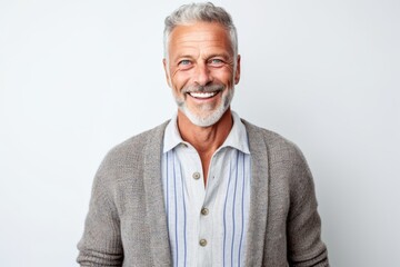 Portrait of a smiling senior man standing isolated on a white background