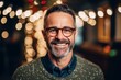 © Robert MEYNER - Portrait of a handsome mature man wearing glasses and smiling at the camera
